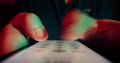 Fingers Using Dial Pad on Phone Close Up