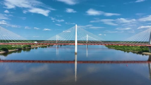 Drone shot of a modern cable-stayed bridge over a river