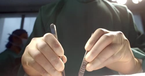 Surgeon's Hands Performing a Delicate Medical Procedure in a Sterile Hospital