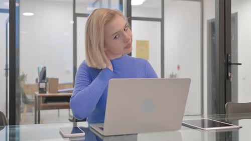 Woman Working at Desk with Neck Pain