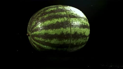 The Watermelon Falls on the Table and Splits in Half Filmed on a Highspeed Camera at 1000 Fps