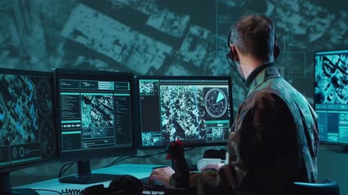 Military Soldier Operating Advanced Technology in a Command Center