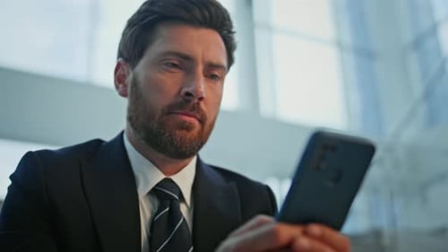 Focused Businessman Using Smartphone on Stairs Office Drinking Coffee Closeup
