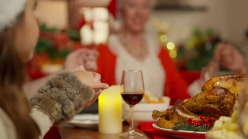 Family Celebrates Christmas Holiday at Home Dinner Table