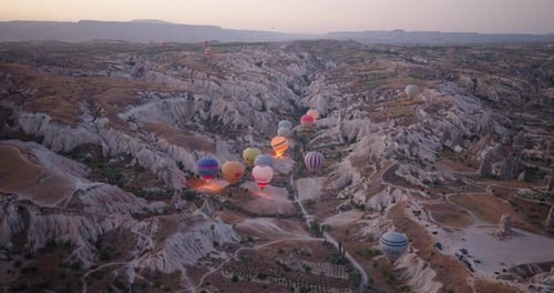 Panoramic view of Cappadocia landscape with hot air balloons, Turkey