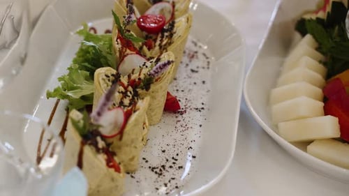Display of Delicious Wraps and Fruit at a Wedding
