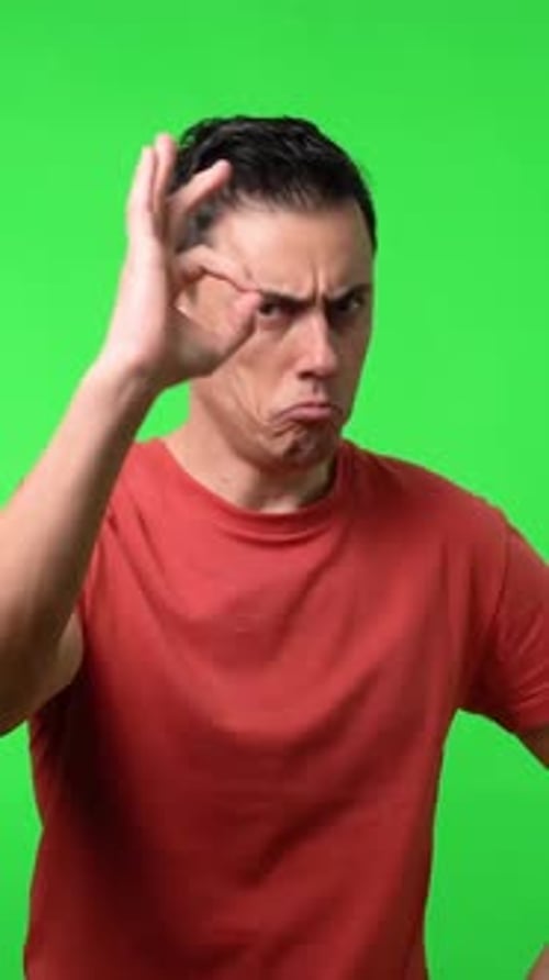 Expressive Man Gesturing Positively on Green Screen Background
