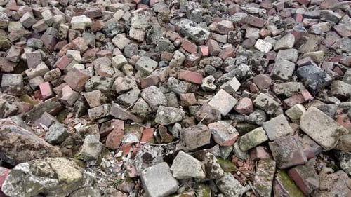 Pile Of Rubble Of Fallen Building At Auschwitz Concentration Camp In Poland. - panning