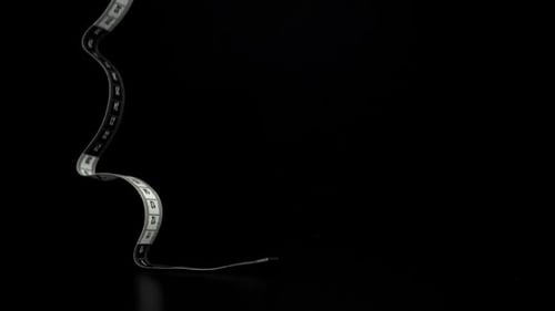 The Measuring Ruler for Sewing Falls on the Table Filmed on a Highspeed Camera at 1000 Fps