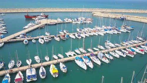 Small Sail boat in calm sea water, Aerial view