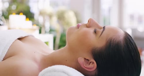 Woman Relaxing on Massage Table in Spa