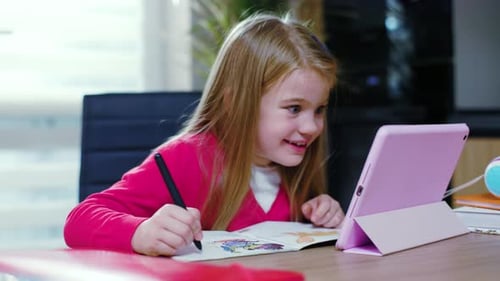 Young Girl Draws and Uses Tablet Device