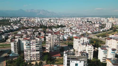 The Camera Takes Off Over the Roofs of Houses in a Southern City