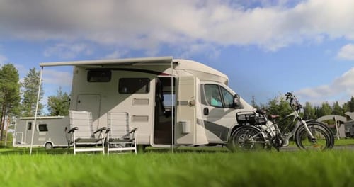 Recreational Vehicle on Lawn with Bicycles