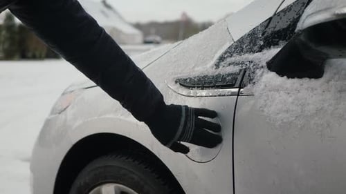 Charging an Electric Car in Winter Snow
