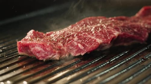Cooking Beef Angus Steak in Restaurant Close Up Pieces of Hot Ribeye Steak Served on the Wooden