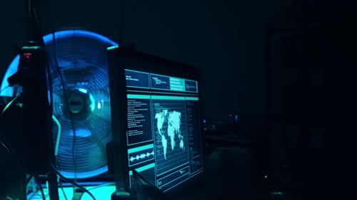 Man Working on Computer in Dark Room at Night