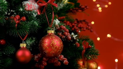 Christmas Tree Decorated with Red Ornaments and Ribbons