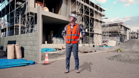 Full Body Of Asian Male Engineer Looking Around With Arms Akimbo At ...