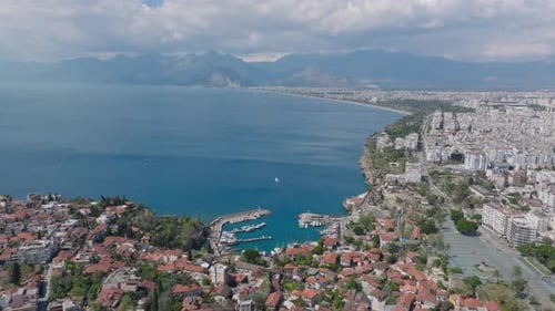 Aerial Panoramic View of Sea Coast and Resort Town High Mountain Ridge in Distance Travel
