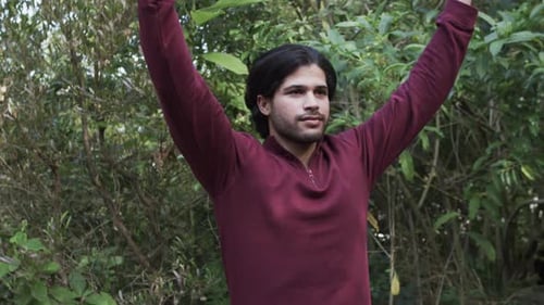 Young Man Meditating in Nature Outdoors