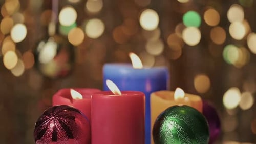 Colorful Candles and Christmas Ornaments with Bokeh Lights
