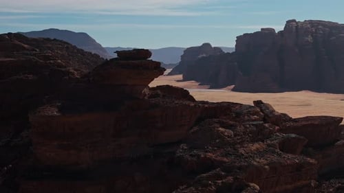 Drone around over small rock and mountains in wadi rum desert in jordan