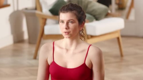 Woman Meditates Indoors Wearing Activewear