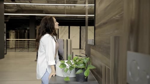 A Woman Examines the Interior of a Bathroom in a Design Service Agency Modern Bathroom