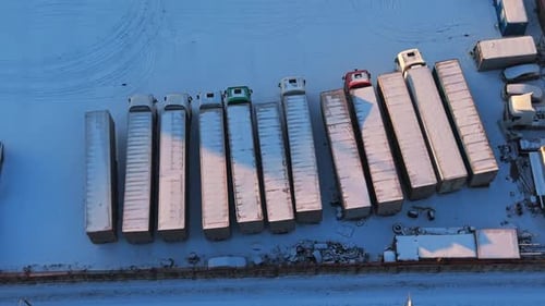 Aerial view of semi trucks parked in winter