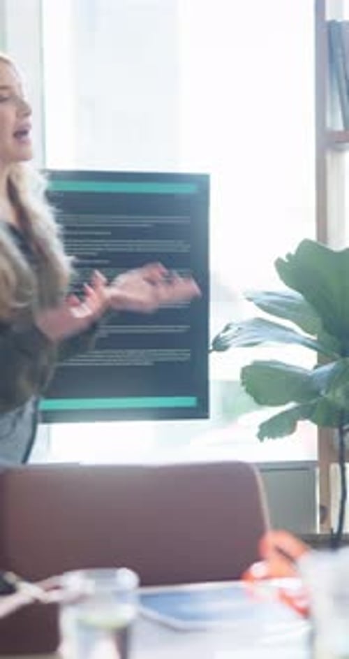Woman Giving Presentation in Bright Office
