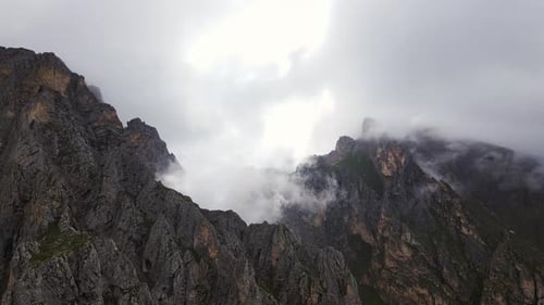 Mountains Peaks Partially Covered in Clouds Aerial