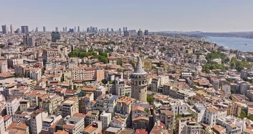Istanbul Turkey Aerial v8 flyover galata watchtower on the european side capturing downtown cityscap