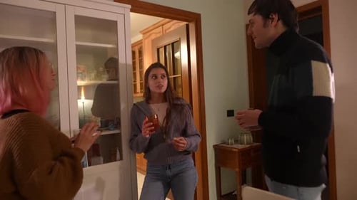 Friends Chatting Indoors Holding Drinks