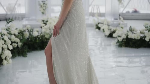 Woman Posing in Sparkling Gown with Thigh Slit