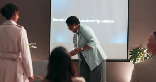 Business woman, handshake and award with congratulations for milestone or achievement at seminar