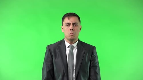 Man Expressing Shock Against Green Screen