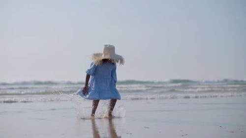 Cute Black Woman Girl in Straw Hat Playing at Seashore Barefoot