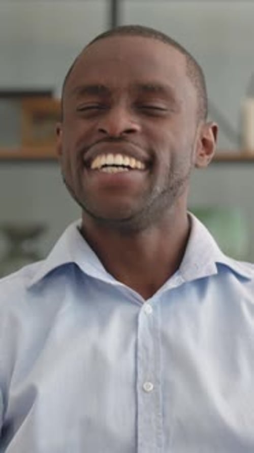 Man Giving Thumbs Up and Smiling Portrait