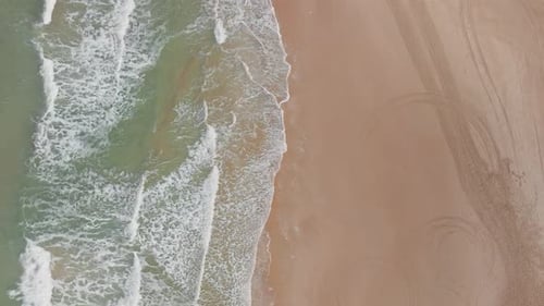 Ocean waves breaking on a rocky shore, Aerial view