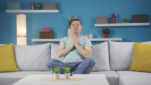 Man Doing Yoga and Stretching at Home