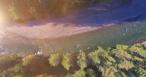 Low Altitude Flight Over Fresh Fast Mountain River with Rocks at Sunny Summer Morning