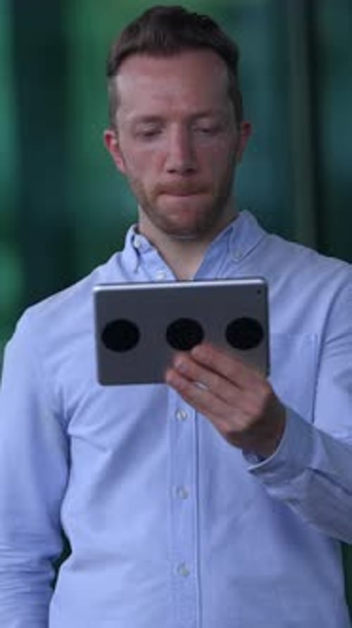 Dedicated and Focused Professional Actively Engaging with Innovative Tablet Technology Solutions