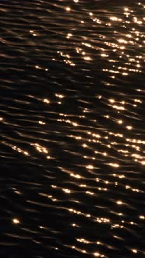 The sea's surface glittered with sparks.