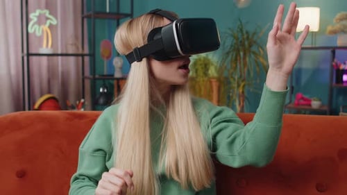 Woman Interacts with VR Goggles in Living Room