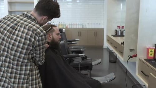 Man Getting Haircut at Modern Barber Shop