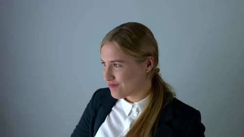 Enthusiastic Young Woman Gesturing and Celebrating Success