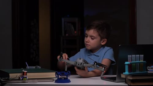 Little Boy Studying Drone Copter Device