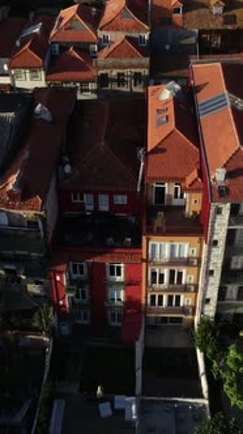 Vertical Video of Historical Typical Buildings in city of Porto, Portugal Aerial View