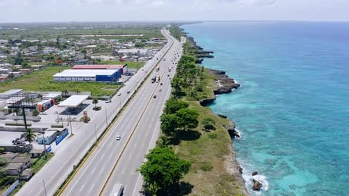 Vehicles Driving At Las Americas Highway Along The Caribbean Sea At Summer In Dominican Republic. -